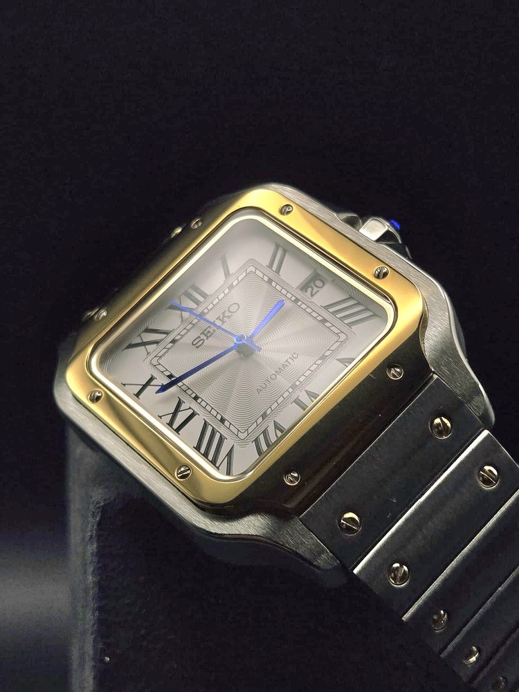 Seiko two-tone automatic with gold bezel, three-quarter view