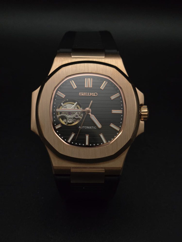 Seiko rose-gold open-heart automatic with black dial on a black strap