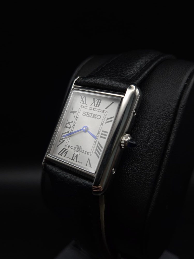 Steel Seiko rectangular dress watch with blued hands, three-quarter view